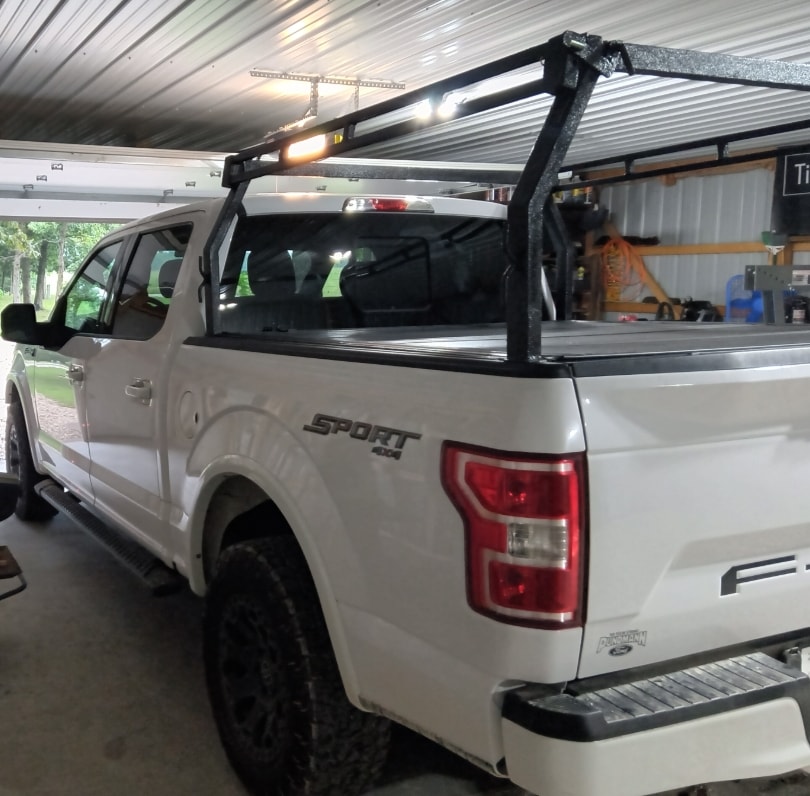 T~RAX rack on white Ford F-150 Sport 4x4, side view